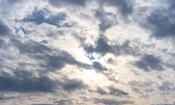 Blue sky with clouds and sun — Stock Photo, Image