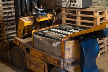 Old forklift, workshop, yellow closeup