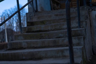 stone staircase with iron railing