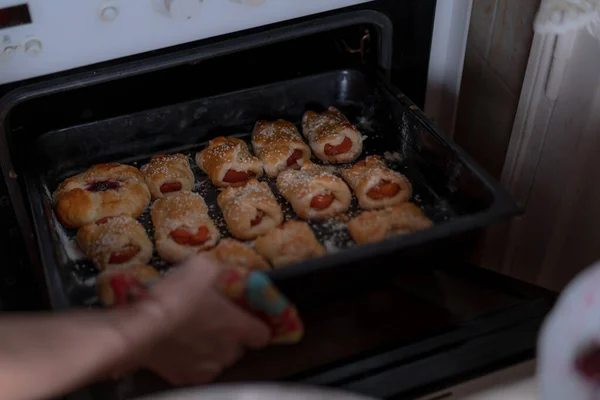 Sweet pastries on a baking sheet from the oven