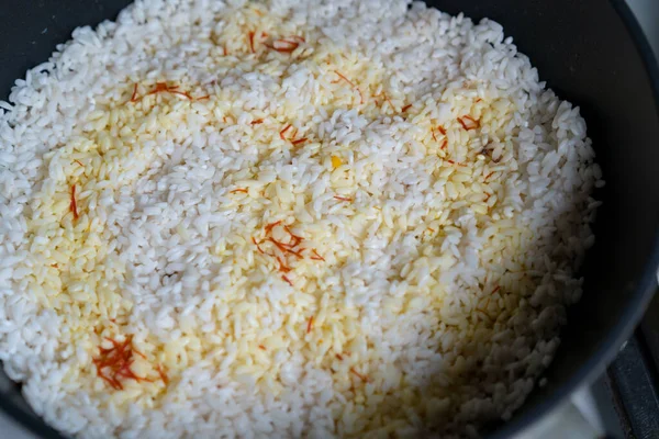 Rice is cooked on the stove