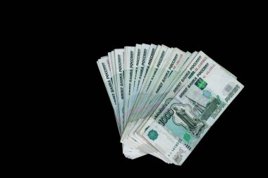 Tahta arka planda bir tomar para