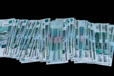 Tahta arka planda bir tomar para