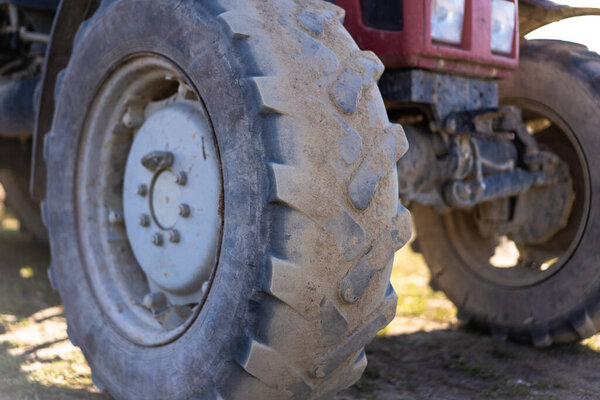 Tractor. Wheels in motion on the ground.