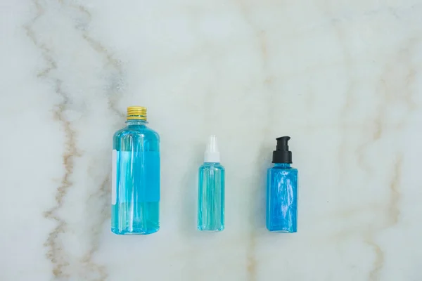 Top View Blue Ethyl Alcohol Different Packages Spray Bottle Plastic — стоковое фото