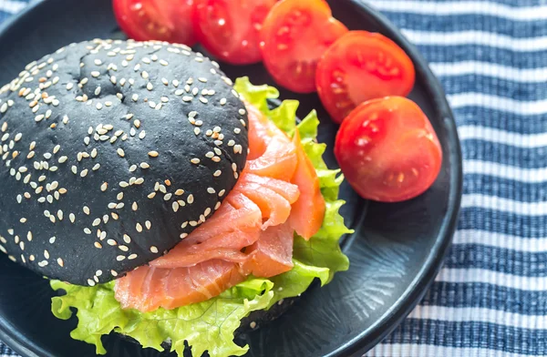 Black sandwich with salmon — Stock Photo, Image