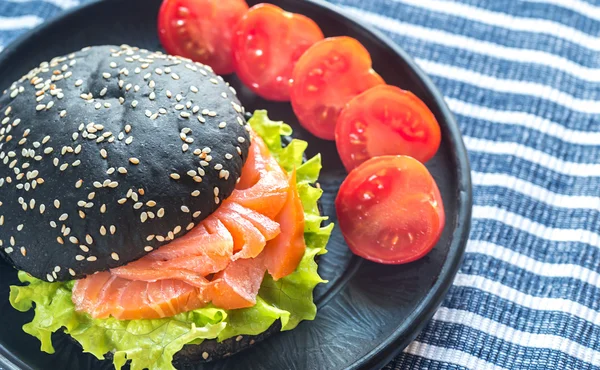 Black sandwich with salmon — Stock Photo, Image
