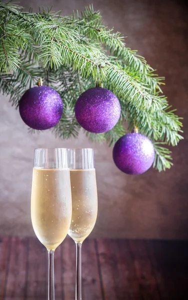 Two glasses of champagne with Christmas tree branch — Stock Photo, Image