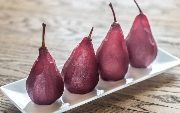 Merlot-poached pears on the plate — Stock Photo, Image