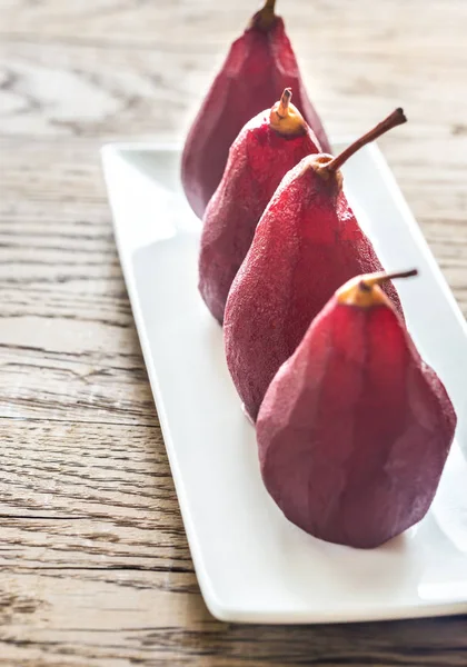 Merlot-poached pears on the plate — Stock Photo, Image