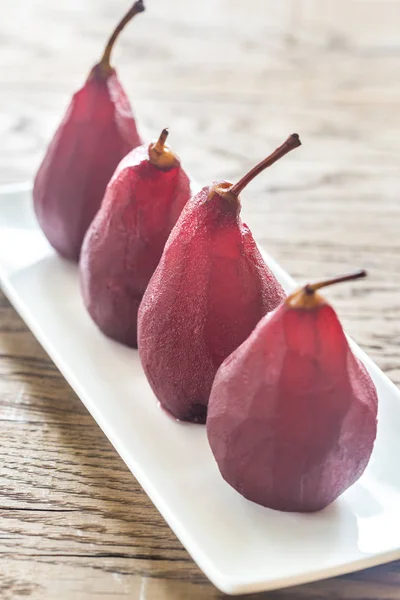 Merlot-poached pears on the plate — Stock Photo, Image