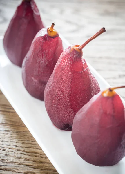 Merlot-poached pears on the plate — Stock Photo, Image