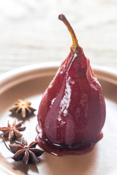 Merlot-poached pear on the plate — Stock Photo, Image