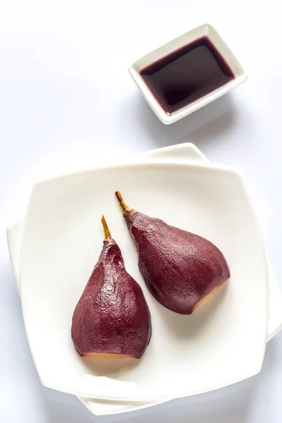 Merlot-poached pear on the plate — Stock Photo, Image