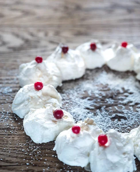 Meringue Christmas wreath on the wooden table — Stock Photo, Image