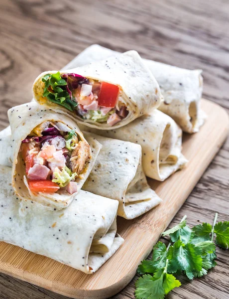 Chicken burritos on the wooden background — Stock Photo, Image