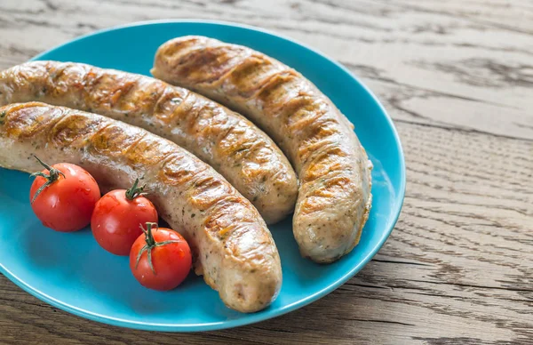 Grilled sausages with cherry tomatoes — Stock Photo, Image