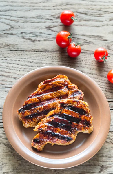 Grilled pork steaks on the plate — Stock Photo, Image