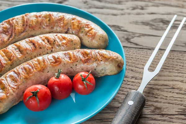 Salsichas grelhadas com tomate cereja — Fotografia de Stock