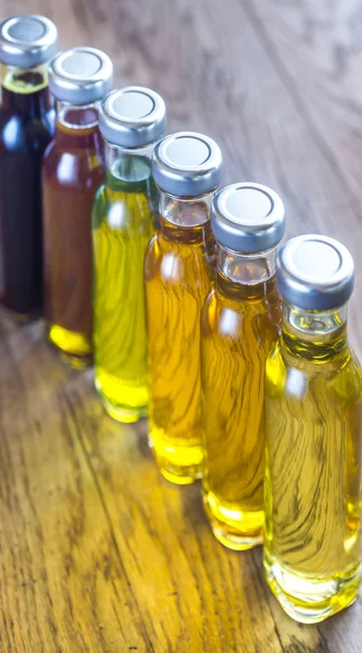 Bottles with different kinds of vegetable oil — Stock Photo, Image