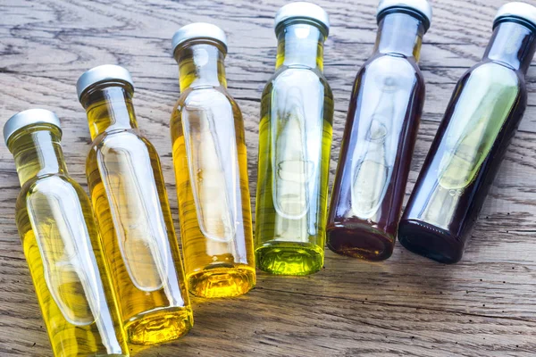 Bottles with different kinds of vegetable oil — Stock Photo, Image