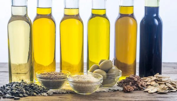 Bottles with different kinds of vegetable oil — Stock Photo, Image