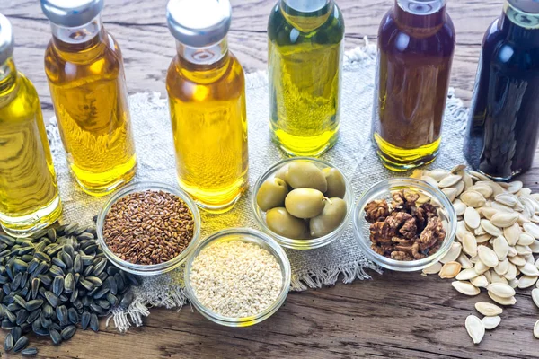 Bottles with different kinds of vegetable oil — Stock Photo, Image