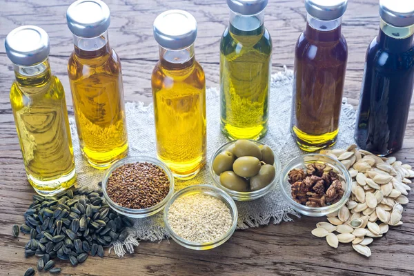 Bottles with different kinds of vegetable oil — Stock Photo, Image