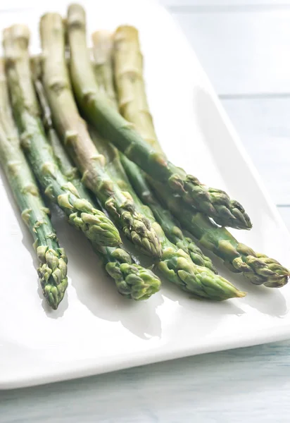 Bunch of cooked asparagus on the plate — Stock Photo, Image