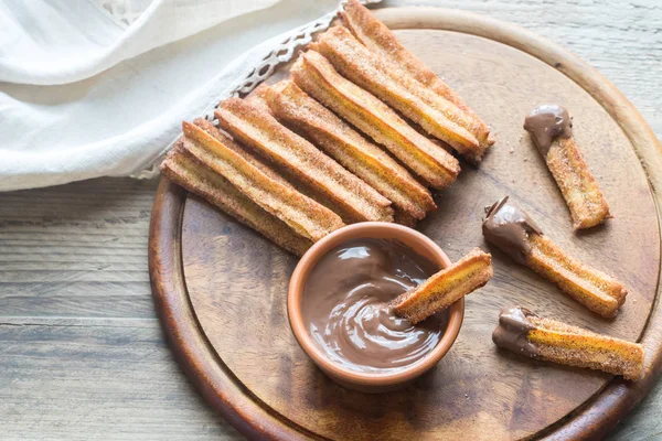 Churros - famous Spanish dessert with chocolate sauce — Stock Photo, Image