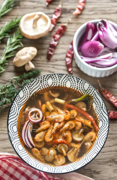 Bowl of thai tom yum soup on the wooden background — Stock Photo, Image