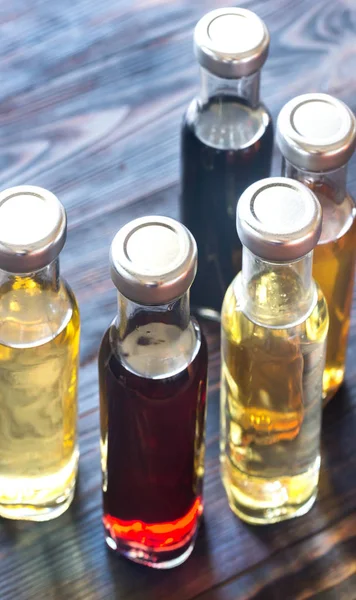 Bottles with different kinds of vinegar — Stock Photo, Image