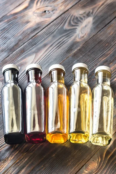 Bottles with different kinds of vinegar — Stock Photo, Image