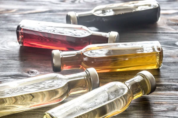 Bottles with different kinds of vinegar — Stock Photo, Image