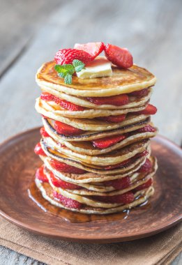 Stack of pancakes with fresh strawberries clipart