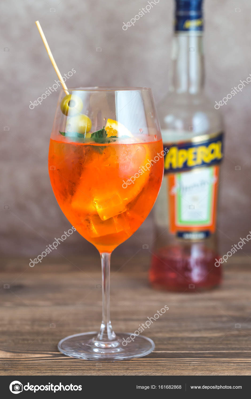 https://st3.depositphotos.com/1998601/16168/i/1600/depositphotos_161682868-stock-photo-glass-of-aperol-spritz-cocktail.jpg