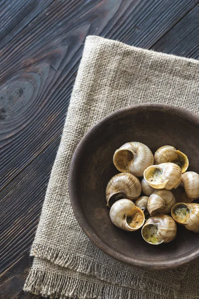 Bowl of cooked snails — Stock Photo, Image