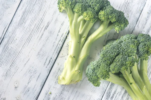 Broccoli on the wooden table — Stock Photo, Image