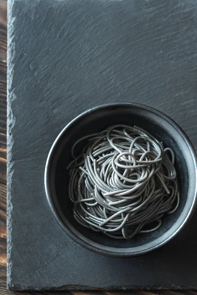 Bowl of pasta with squid ink — Stock Photo, Image