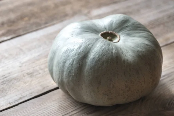 Ripe pumpkin on the wooden background — Stock Photo, Image