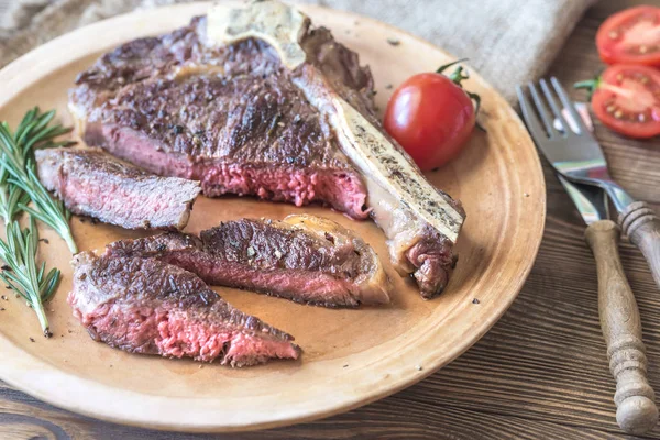 Beef steak with fresh rosemary — Stock Photo, Image
