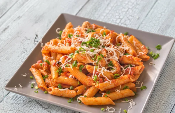 Portion of cheesy chicken pasta — Stock Photo, Image