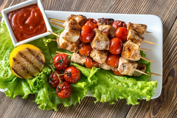 Grilled chicken skewers on the white plate — Stock Photo, Image