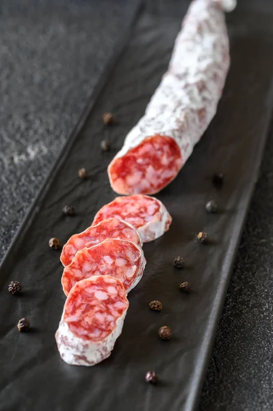 Fuet Catalan Dry Cured Sausage Black Serving Plate — Stock Photo, Image