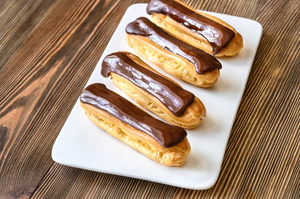 Eclairs Chocolate Topping Serving Plate — Stock Photo, Image