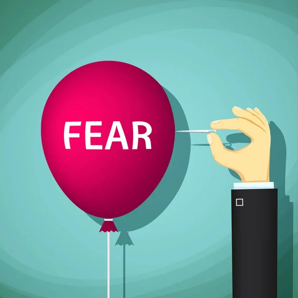 El hombre rompe un globo con la palabra miedo —  Fotos de Stock