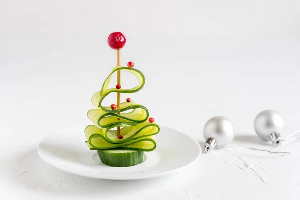 Cucumber Christmas tree, funny food for kids. Christmas food background.