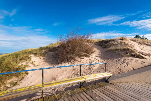 Grass dunes and beautiful beach with white sand. Baltic Sea. Poland