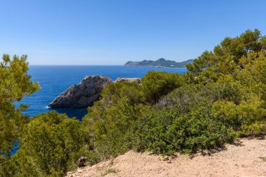 Rocky coast with blue sea. Cala Ratjada , north-east coast of Majorca. Spain
