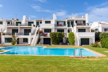 Minorca, Spain - October 12, 2019: Summer villas with swimming pool in the beautiful town of Fornells on Menorca